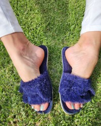 Sexy female feet in slippers photo