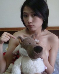 Sweet Chinese babe teasing in lingerie photo