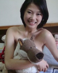 Sweet Chinese babe teasing in lingerie photo