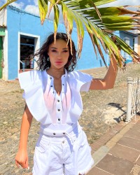Monika Fox In White Bodysuit On City Streets photo