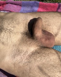 Lying naked in the warm spring sun photo