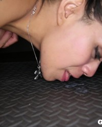 latina MILF swallows strangers cum in gloryhole booth photo