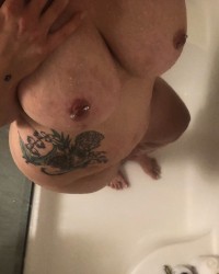 Body Shots of Tattooed Babe with Pierced Nipples photo
