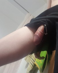 Guy wearing shorts with hung cock hanging out photo