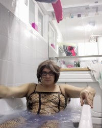 PAtty crossdresser in a bath in bodystocking photo