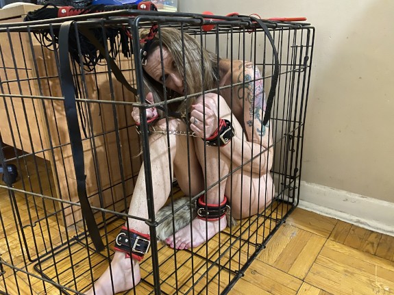 Kelli in a cage...