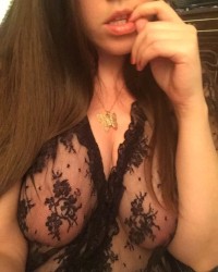 Thicc girl wears black lace and lets you sneak a peek photo