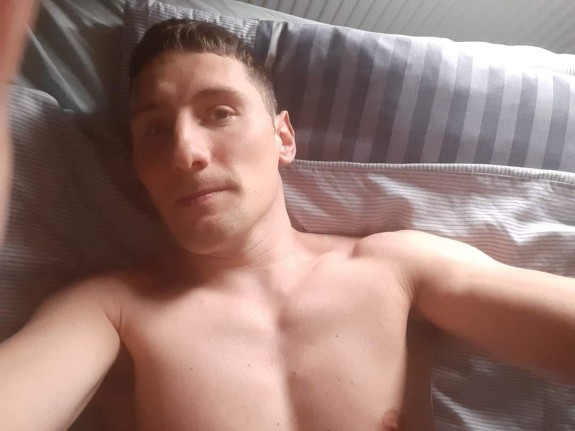 Man laid on bed wanting to fucked photo