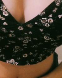 The bitch undresses on camera and shows her tight pussy and big tits. photo