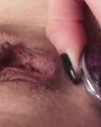 Beauty with a big ass fucks herself in the butt hole with a big butt plug photo