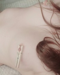 Feeling cute with clothespins on my nipples photo