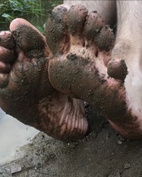 Muddy Filthy dirty bare feet photo
