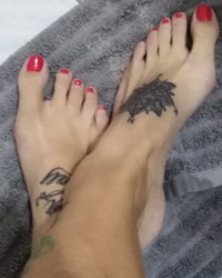 Sexy tattooed feet photo