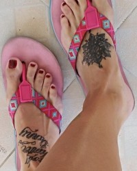 Sexy tattooed feet photo