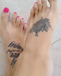 Sexy tattooed feet photo