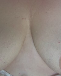 Big Boobs get covered in CUM photo