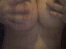 Pinching the Nipples on My Natural Tits gif