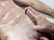 massaging his ejaculating penis gif