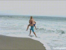 Samantha Rone in tiny Brazilian bikini carried on beach gif