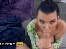 Busty Milf Romi Rain uses both hands to suck a big cock gif