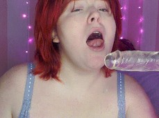 Slutty Redhead Gags on dildo gif