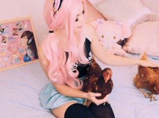 Belle Delphine strokes two BIG cocks gif