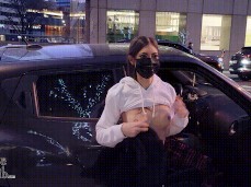 Exhibitionist wife flashes tits while changing top on busy street gif