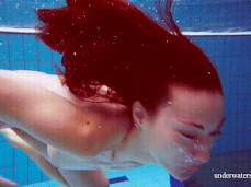 Woman swimming nude, kicking the  gif