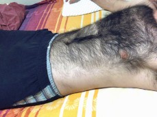 Hairy chest dude runs his fingers through fur gif