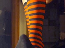 Sexy girl ballbusting from above in red socks gif