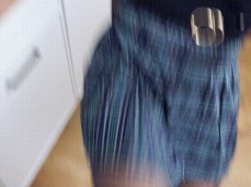 Readheaded girl trains self-defense in the kitchen, kicking balls gif