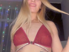 Blonde model shows her charms on  and caresses her pink pussy gif