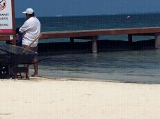 Topless and pussy slip at public beach (by Kaexhib) gif