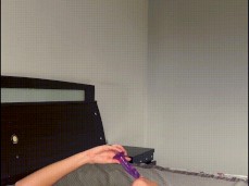 Milf with a big ass caresses herself and plays with a vibrator on the bed gif