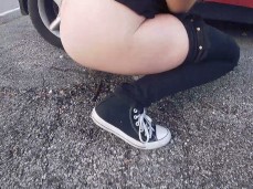 Brunette peeing on the street gif