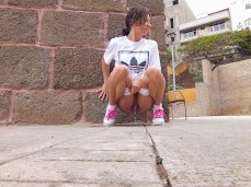 Risky pee in the city center gif
