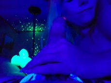 Goth girl strokes big dick in blacklight gif