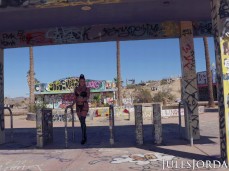 Angela White in thong walks into abandoned park gif