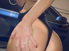 Wife Alyssia Vera shows off her thong bodysuit to you in garage gif