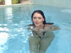 Sexy wife Sophie Dee approaches you in pool in slingshot bikini gif