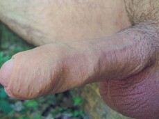 Horny stud offers a close-up view of his big, hard, throbbing uncut cock gif