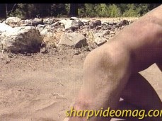 Two naked men wrestling in the dirt gif