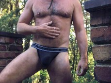 Bearded, buff, hairy-chested muscle daddy waiting for things to come 0016-1 gif
