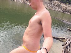 Beefy, young, uncut Dutchman wades into a lake, wearing a Tarzan strap gif