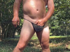 Beefy, horny daddy bear rubs the bulge in his G-string 0159-1 outdoors gif