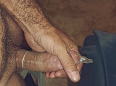 A tasty huge cock in a condom gif