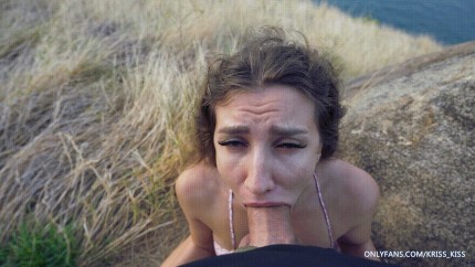 Gorgeous petite babe with her mouth full of thick cock at sunrise blowjob.