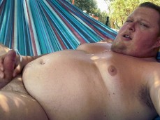 Chubby construction worker takes a refreshing break in patron's hammock gif