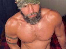 Bearded, sexy buff dude sits on his knees, stroking his pretty dick 0502-1 gif