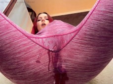 Slim redhead Lina Moor fingers her pussy to squirty orgasm in leggings gif